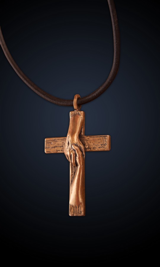 Tom White Studios, Inc | Cross Sculptures Rescued Cross bronze necklace of sculpture created by Christian sculptor, Tom White. Depicts Jesus nail-scarred hand rescuing mankind by His great love shown on Calvary by His death and the power of His Resurrection. Available in necklaces and wall hangings.