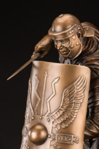 Roman Centurion Soldier bronze statue from line of gladiators and historical sculptures of warriors and weaponry including shields, swords and battle axes by master sculptor, Tom White.