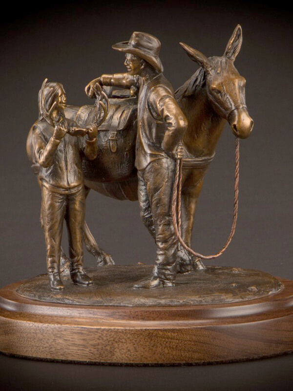 Father Daughter Hunting sculpture in bronze by wildlife and figurative sculptor, Tom White, who is an avid outdoorsman.