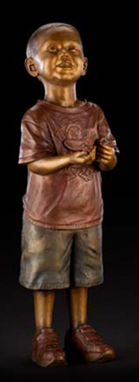 Will & His Trains life-size portrait bronze of Will Berndt playing with his trains placed in Cavehill Cemetery, Louisville, KY, by commissioned memorial bronze sculptor, Tom White.