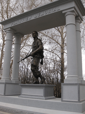 Vietnam Soldier Memorial Statue, American Legion Park & Veterans Memorial, Pinedale, Wyoming. Soldier with 1,000 yard stare carrying his fallen buddy&rsquo;s helmet created by master sculptor, Tom White.