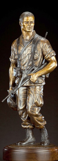 Vietnam Soldier Memorial Statue, American Legion Park & Veterans Memorial, Pinedale, Wyoming. Soldier with 1,000 yard stare carrying his fallen buddy&rsquo;s helmet created by master sculptor, Tom White.