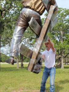 Bo Rubenstein Statue - portrait sculpture of owner of Texas Pipe for his Frebo Ranch in Columbus, Texas. Figurative memorial bronze sculptures by master Texas / Arizona commission sculptor, Tom White installing monument
