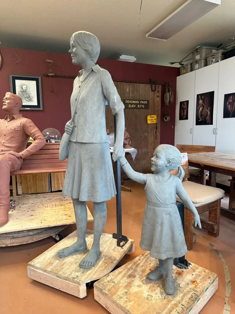 Tom White Studios, Inc | St Angela Merici & Dorothy Kazel Saint Angela Merici Statue & Dorothy Kazel bronze portrait sculpture scene commissioned by Urban Community School and created by Tom White, Sculptor. St Angela Merici was the founder of the Ursuline nuns in the 1400’s