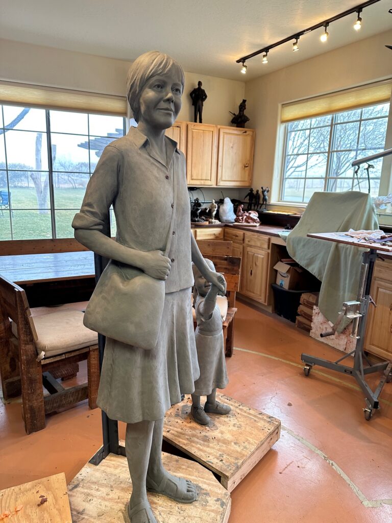 Tom White Studios, Inc | St Angela Merici & Dorothy Kazel Saint Angela Merici Statue & Dorothy Kazel bronze portrait sculpture scene commissioned by Urban Community School and created by Tom White, Sculptor. St Angela Merici was the founder of the Ursuline nuns in the 1400’s.